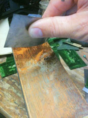 Our weapon of choice, the cabinet scraper.